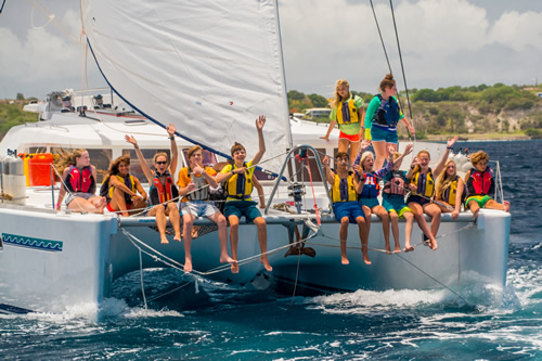 Teens sailing in the Caribbean.