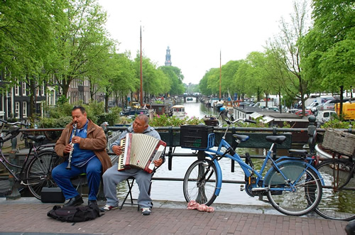Musician on bridge over canal near the author's apartment in Amsterdam.