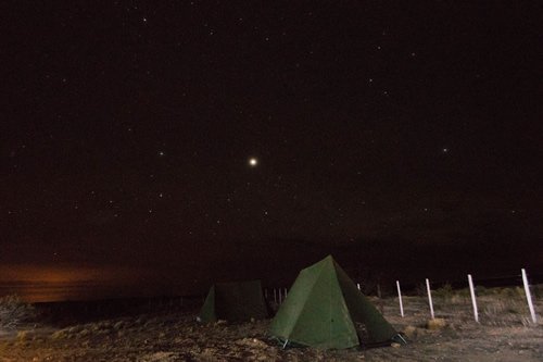Small group travel camping beneath the stars.