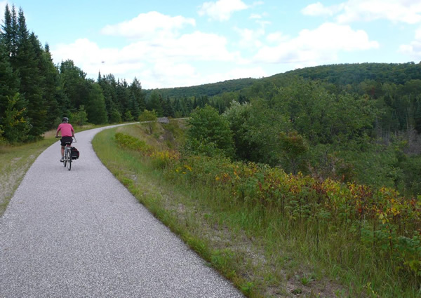 Cycling through wooded  landscapes in the Laurentians.