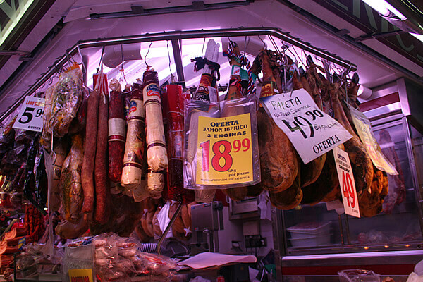 Sausages and hams at Santa Caterina market in Barcelona.