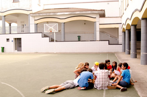 Students learning an English game in their physical education class.