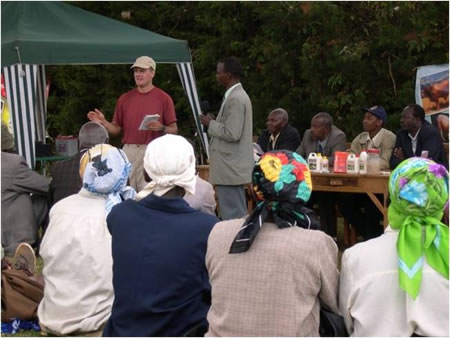 Volunteer training dairy producers in Kenya.