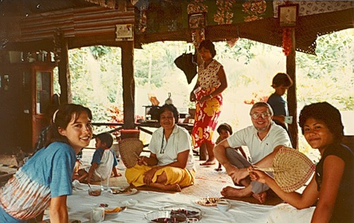 Carrie Hessler-Radelet with local family while in the Peace Corps.