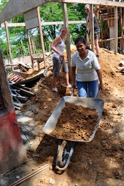 European Disaster volunteers and Buklod Tao reconstructing a home.