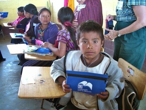 Volunteer with children in Guatemala in the classroom.
