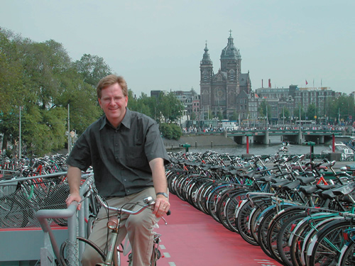 Rick Steves on a bike in Amsterdam.