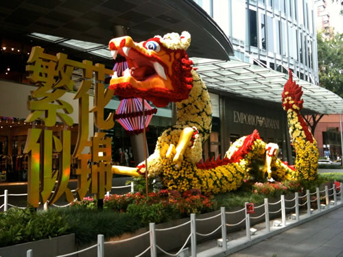 The lively statue in front of a Singapore shopping center.