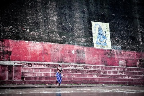 Man washing in Ganges river, Varanasi, India.