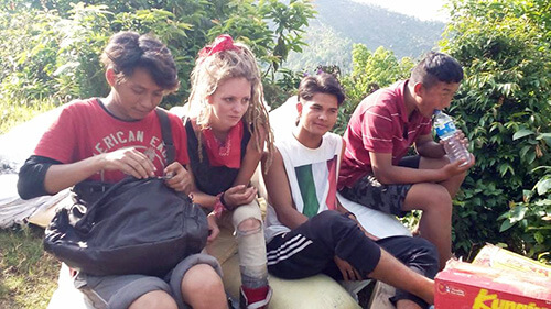 Group of aid workers with boxes of supplies in Gorkha, Nepal.