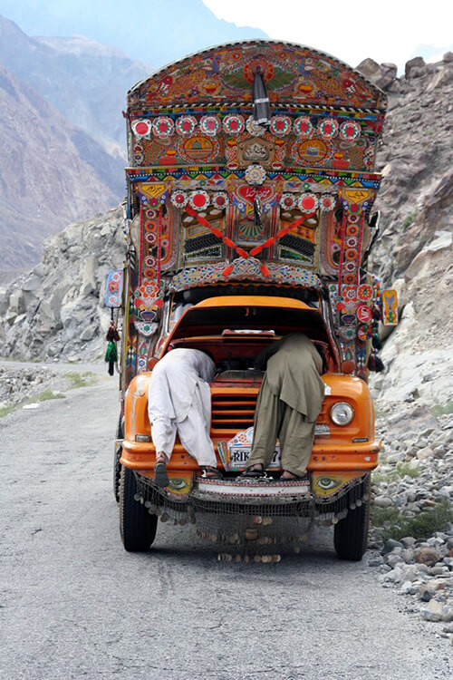 A broken-down bus resembling a pageant float in Pakistan.