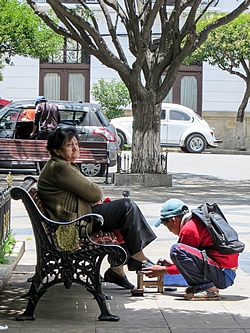 Bolivian child shining shoes.