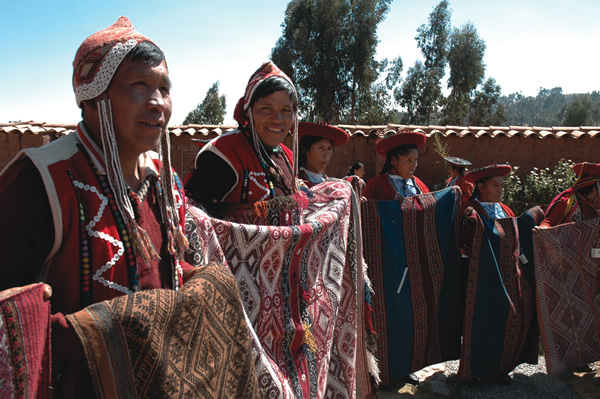 Peruvian weavers proudly display winning entries.