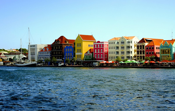 Travel to colorful Curacao by the ocean.