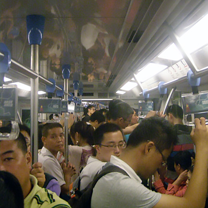 Busy subway car at rush hour in China.