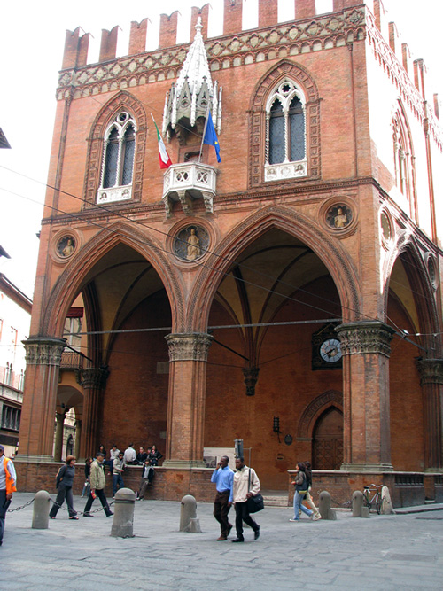 Students in Bologna, Italy relaxing as they walk the streets around a square.