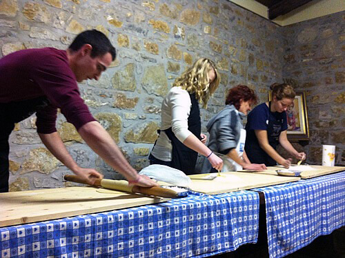 Arcadia students make fresh pasta with the Orsini family.