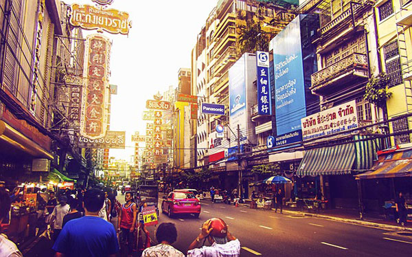 Thai signs on a busy street in Bangkok, Thailand.